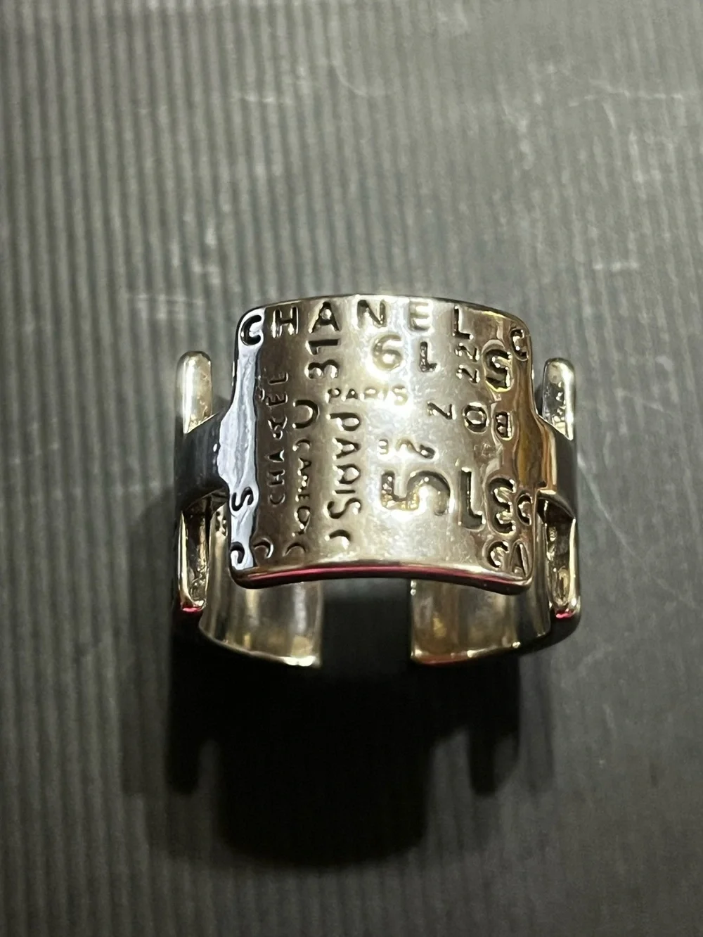 CHANEL Silver Cuff Ring with Embossed Logo